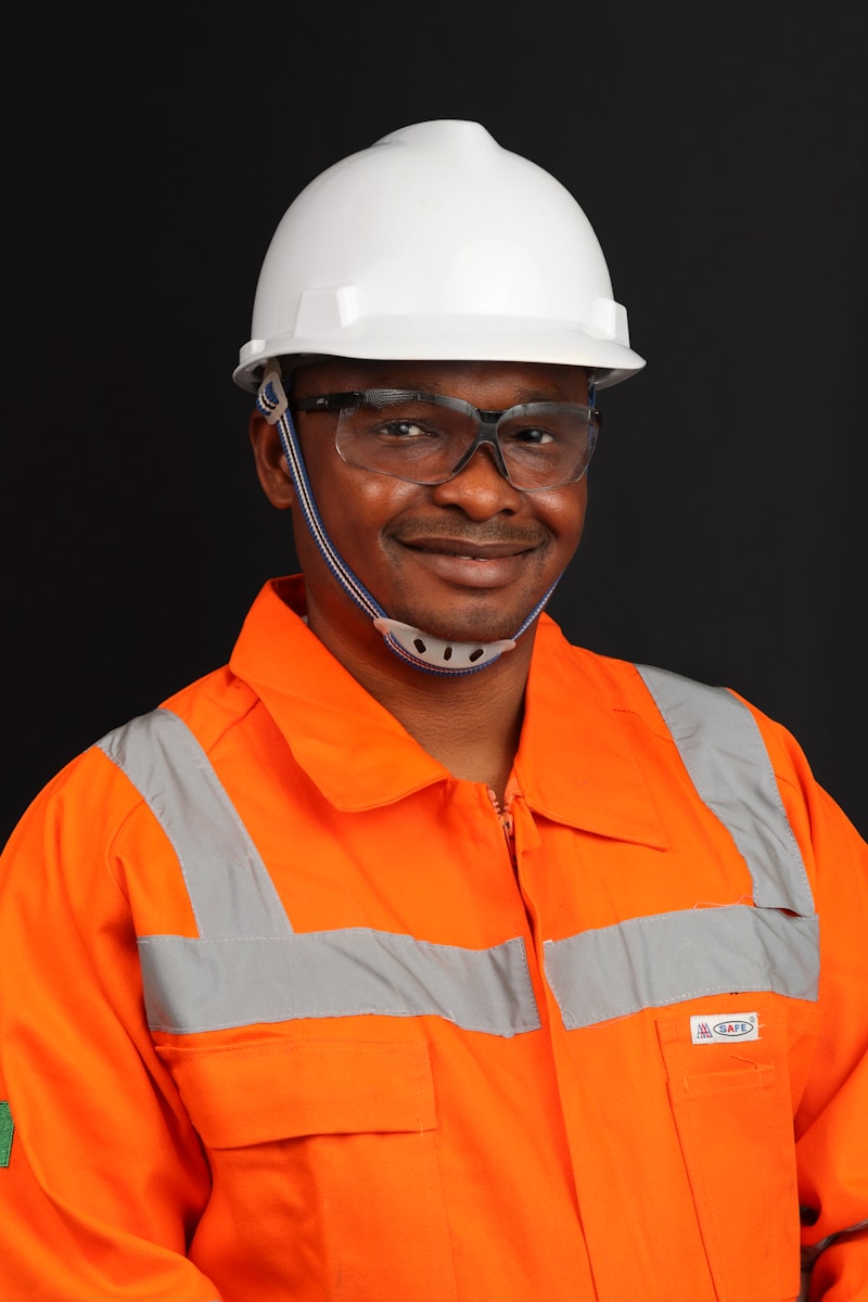 a man wearing a hard hat and safety gear